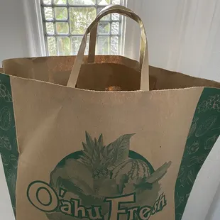 Arrived in a logoed paper bag