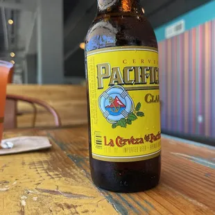 a bottle of beer on a table