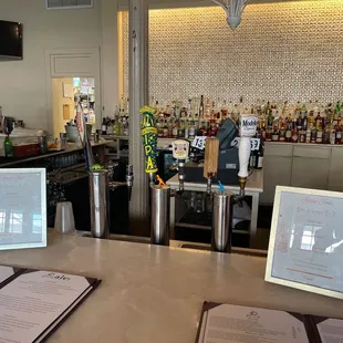a bar with menus on the counter