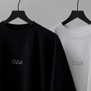 two t - shirts hanging on a hanger