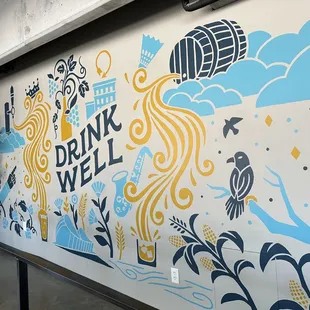 a mural of a drink well