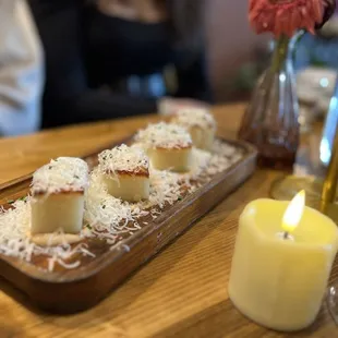 Thousand-Layer Crispy Potato Pave Shaved Pecorino Cheese, Bravas Sauce, Chives