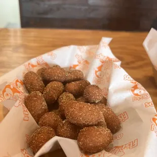 a basket of fried donuts