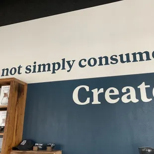 Do not simply consume. Create. Sign at store entrance: