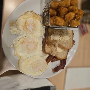 3 eggs and bacon with tater tots and 1 slice toast.