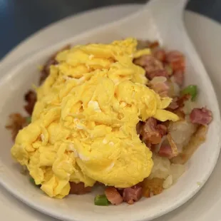 an omelet with ham and peas