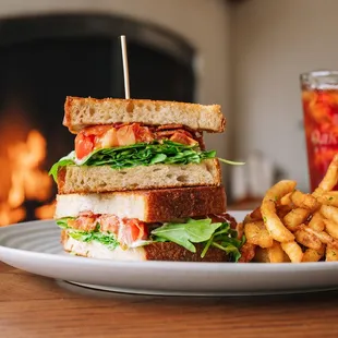 a sandwich and fries on a plate