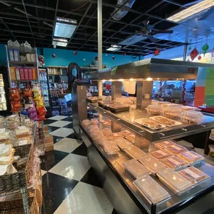 Prepared hot food kept warm near the front cash registers.