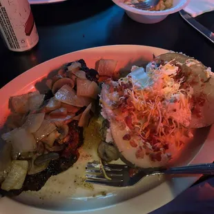 Strip steak with onions and mushrooms.  Loaded baked potato.