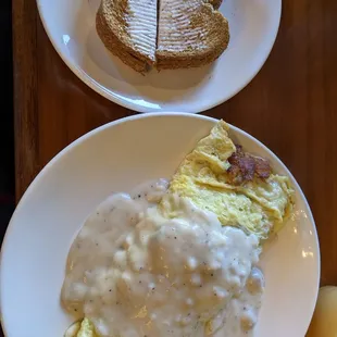 Chef&apos;s choice omelette. Stuffed with homemade hash browns, ham, bacon, and onions. The southern gravy topping adds a great flavor.