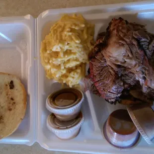 Brisket sandwich with cheesy spaghetti.  Large portions.