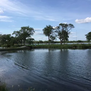 Bridge to a little island with some benches