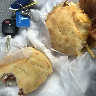 a half eaten sandwich and a car key