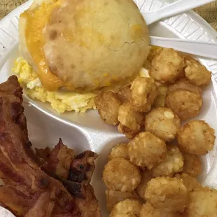 Great breakfast. Two scrambled eggs, bacon, hash rounds, and a cheese biscuit.