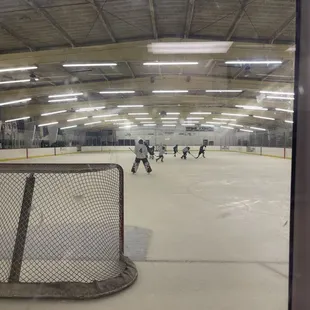 Kids hockey game in action.