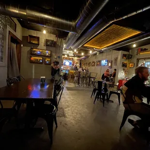 people sitting at tables in a restaurant