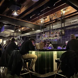 people sitting at a bar