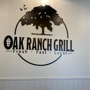 the logo on the wall