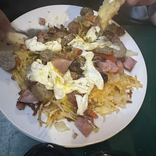 Birkie: choice of protein, hash browns, cheese, onions, green peppers,2 eggs, toast. Choice of sausage, bacon, ham, or chorizo.