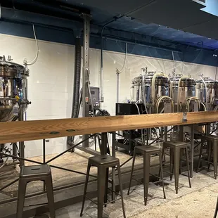 rows of beer tanks and stools