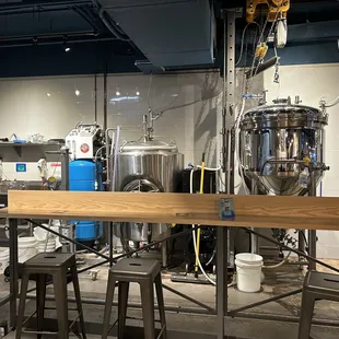 a bar with stools in the foreground