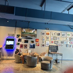 a man sitting in a chair and watching television