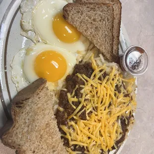 Chili hash brown and cheese with 2 eggs and whole wheat toast.