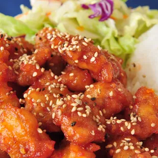 a plate of food with rice and lettuce