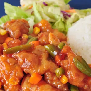 a plate of food with rice and vegetables