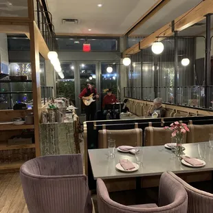a restaurant with tables and chairs