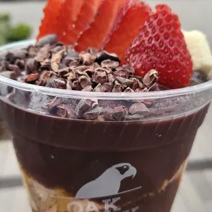 Classic (12 oz.) bowl with granola, OAK PB crumbs, cacao nibs, strawberry, banana, and honey - $11