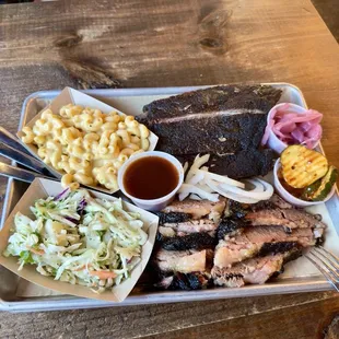 Brisket, pork ribs, mac and cheese, and cole slaw.