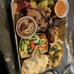 Brisket, burnt ends, cucumber salad, seasonal veggies, potato salad