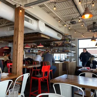 people sitting at tables in a restaurant