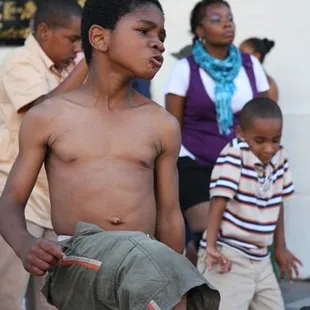 a young boy playing with a frisbee