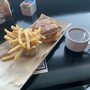 a burger and fries on a table