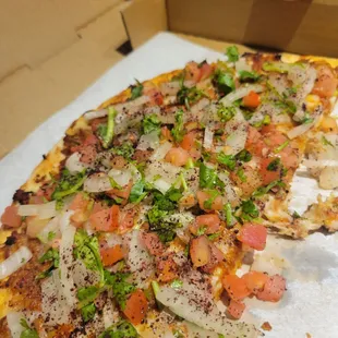 a pizza in a cardboard box
