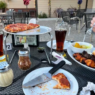 a plate of food and a glass of beer