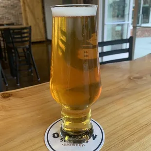 a glass of beer on a table