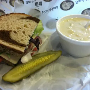 Corned beef and Swiss in marble rye with a pickle and clam chowder