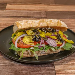 Savor the freshness of nature with our &apos;Veggie Delight Sandwich - a vibrant medley of fresh vegetables and delectable condiments.