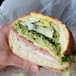 1/2 of sammy pictured.  Ham, turkey, bacon, p jack, toasted.  Lettuce, spinach, sprouts, avocado, pickles on dutch.  About $8 and so good