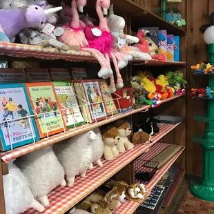 a shelf of stuffed animals in a store