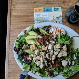 Cobb salad with chicken, avocado, bacon and Caesar dressing, quite good.