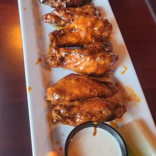 Bone-in Wings.  Front:  Spicy Garlic / Back:  Teriyaki Glaze.  Both Were Excellent.  Not Sure Why The Obvious Size Difference...