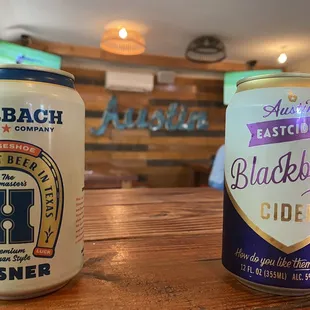 two cans of beer on a table