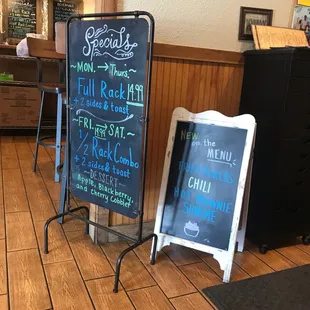 a chalkboard sign in a restaurant