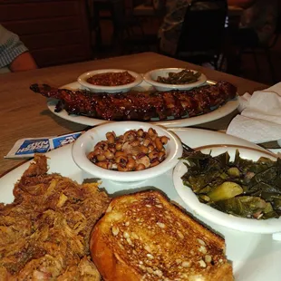 Baby backs, bbq pork, beans n greens.