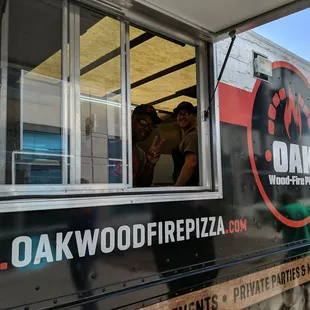 two people looking out the window