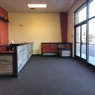 Front desk and waiting area. Plenty of seating on both sides.